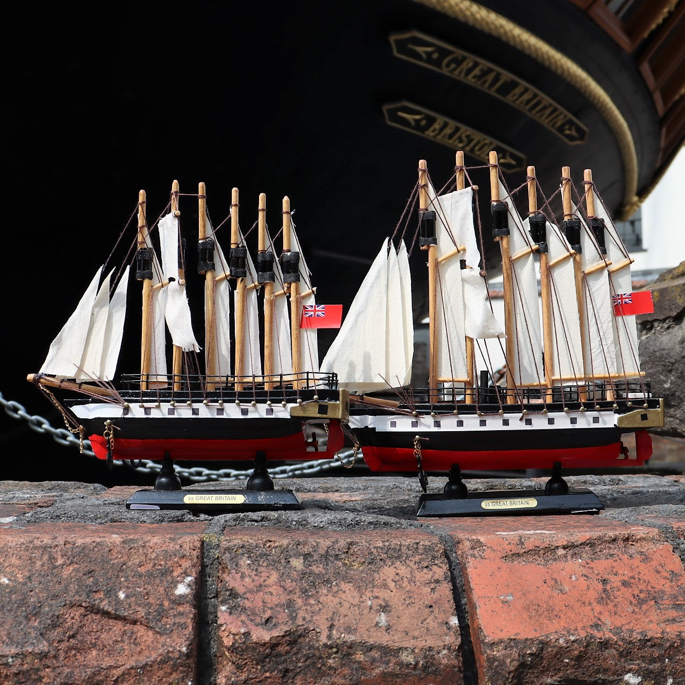 Handmade wooden model of the SS Great Britain displayed on a stand.