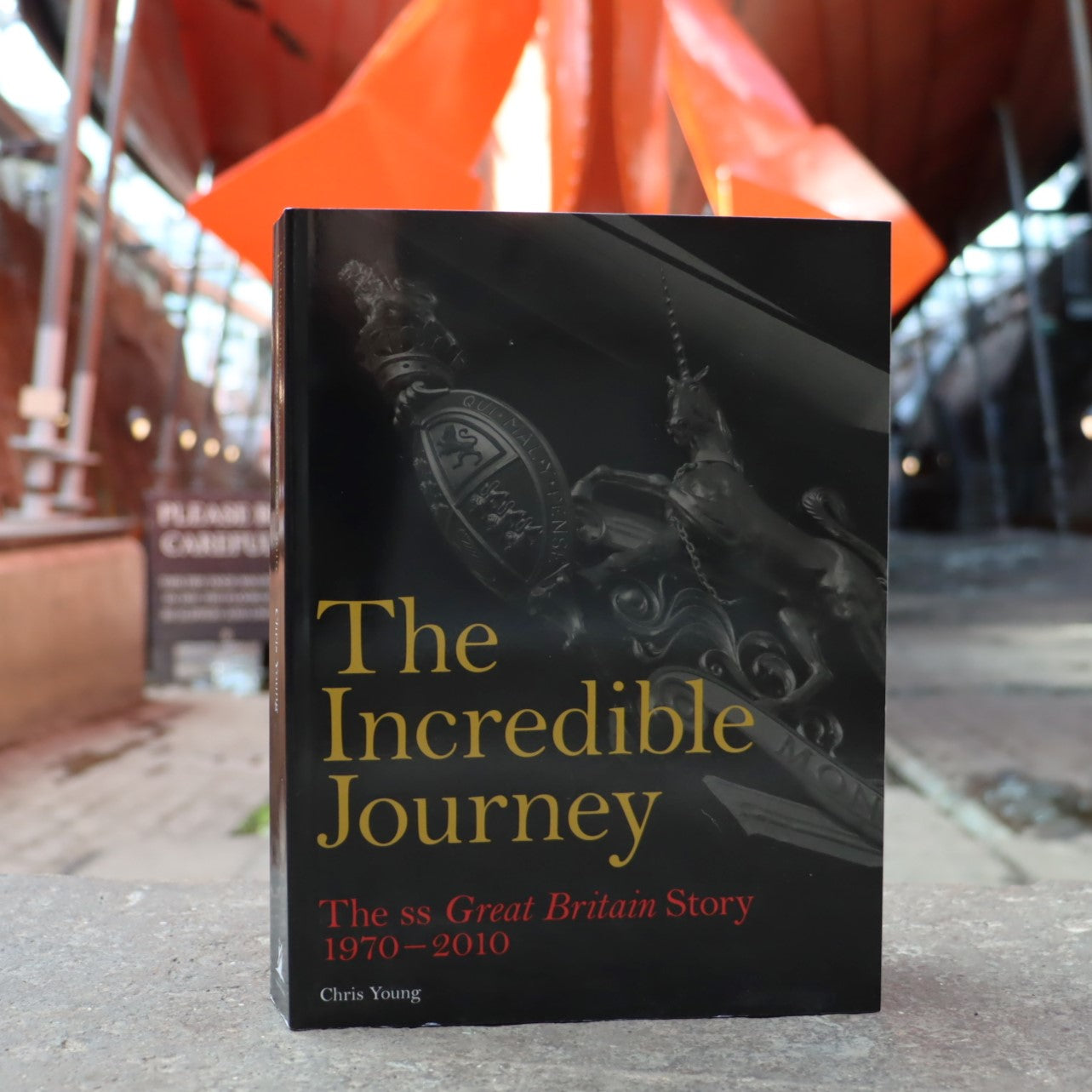 A book titled 'The Incredible Journey' about the SS Great Britain, with a background featuring the ship itself.